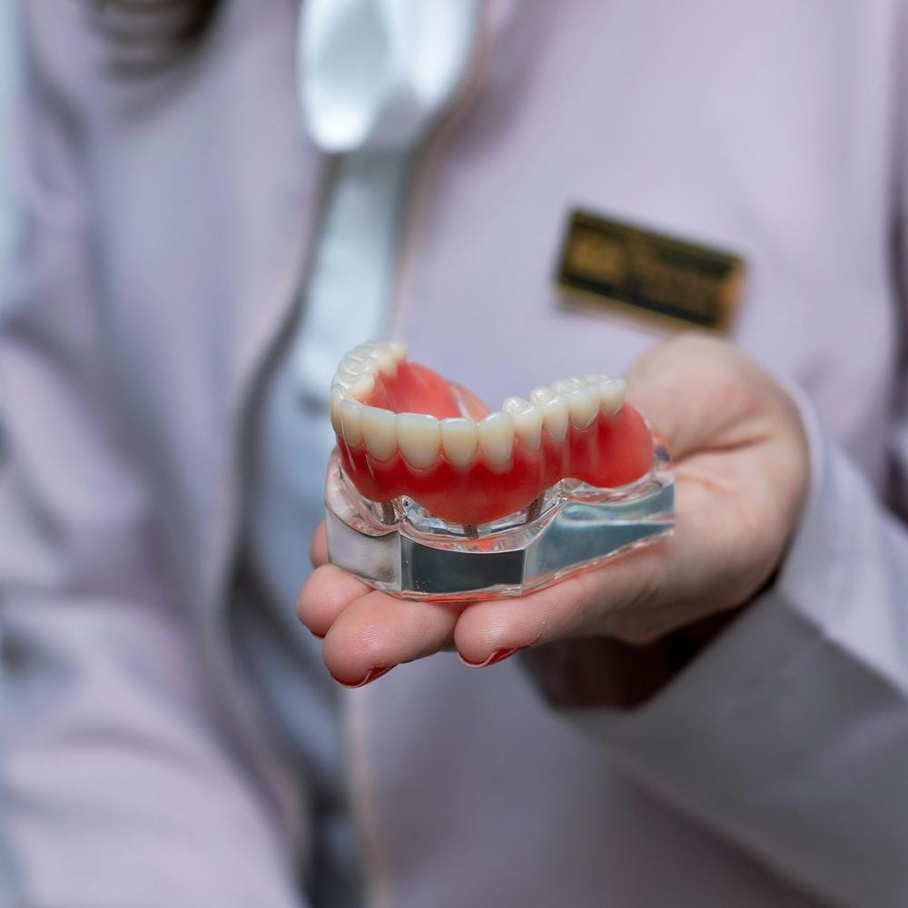 IU how much do 3 on 6 dental implants cost?