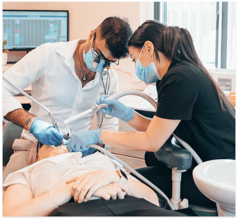 Surgeons Removing a Wisdom Tooth