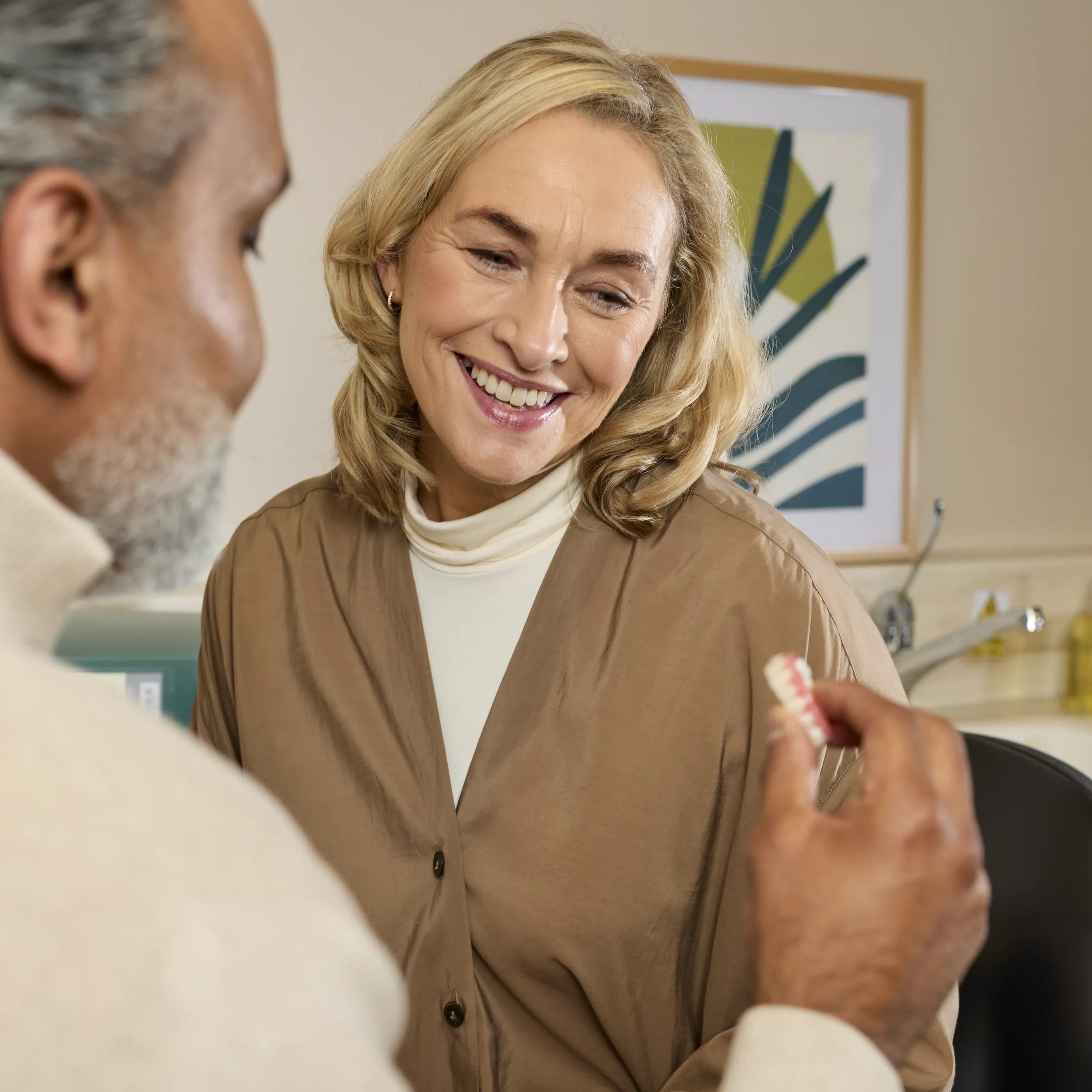 Dental implants patient being shown a bridge